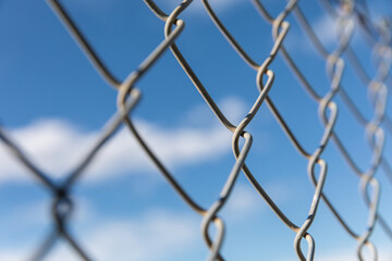 Fototapeta premium metal fence against blue sky
