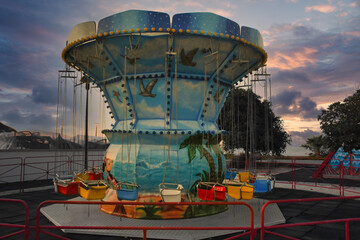 A carousel in an empty amusement park on an autumn evening