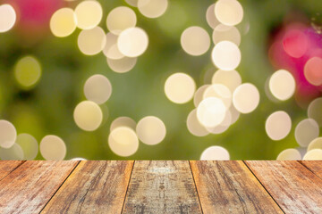 Naklejka na ściany i meble Empty wood table top with blur Christmas tree with bokeh light background