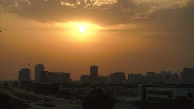 Orange sky city sunset, view of the city and the mosque. dubai suburb. High quality FullHD footage