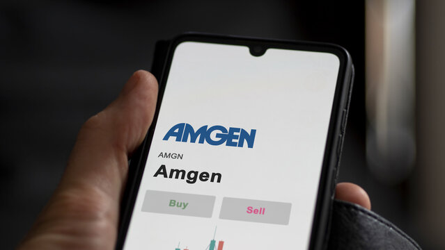 September 13th 2022, New York. An investor's analyzing the Amgen AMGN stock on screen. A phone shows the amgen prices to invest
