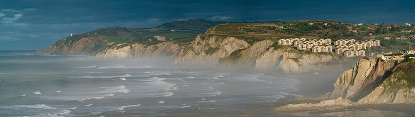 Detail of the coast in Sopelana in a foggy evening dusk, Basque Country, Spain.