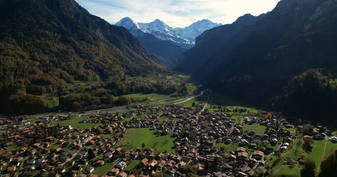 Wilderswil drone shot with Eiger, M&ouml;nch, Jungfrau and train passing - Aerial 4K