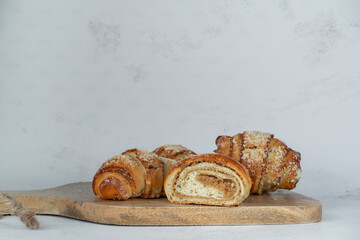 Fresh traditional polish pastry with poppy-seed filling and nuts. St. Martin's croissant, Rogal marciński or świętomarciński. Composition with copy space. - obrazy, fototapety, plakaty