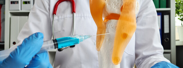 Injection for osteoarthritis of knee closeup. Osteoporosis of bones