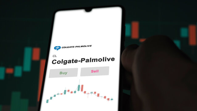 September 13th 2022, New York. An investor's analyzing the Colgate-Palmolive CL stock on screen. A phone shows the prices to invest