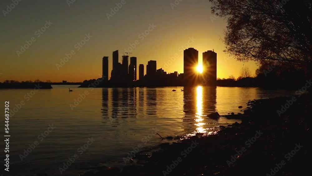 Wall mural Cityscape and sunset at evening time. A beautiful and dramatic panoramic cityscape - Wall murals