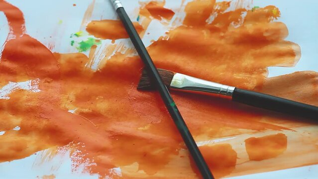Grunge pattern. Abstractionism in modern style. Orange paint on white sheet.