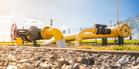 Big gas pipe - natural gas transport system. Transmission infrastructure coming from the ground,...