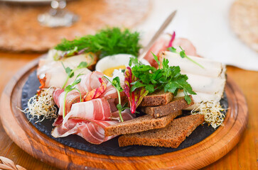 bacon with black bread and herbs, a beautiful appetizer dish