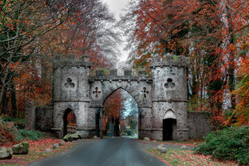 Castle towers at the entrance of Tollymore forest park  in autumn. Newcastle, County Down, Northern...
