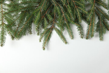 Holidays greeting card or banner composition with pine tree branches. Merry Christmas background and Happy New Year 2023.