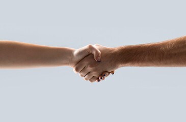 Friendly handshake, friends greeting, teamwork, friendship woman. Two hands, helping arm of a friend, teamwork. Closeup. Helping hand outstretched, isolated arm, salvation girl. Close up help hand