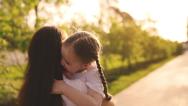 Little Child Runs Hug His Mother. Happy Family. Mom Daughter Child Hugging Park. Kid Kisses His Mother Cheek. Happy Family Concept. Happy Mother Happy Child. Teamwork. Parental Care Concern. Dream.