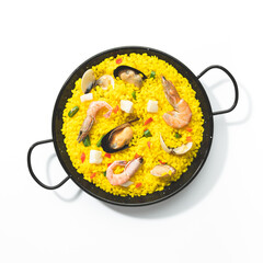Paella isolated on white background. Top view.