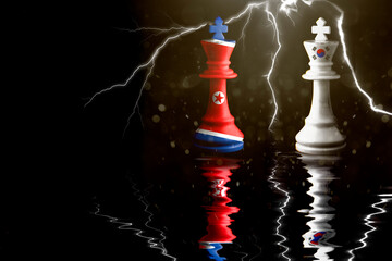 north korea and south korea flags paint over on chess king. 3D illustration north korea vs south...