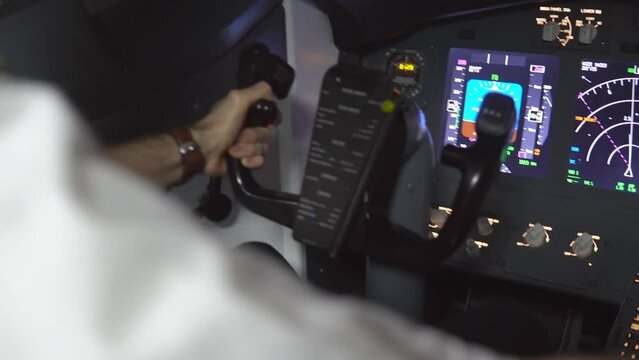 Closeup of professional pilot controlling passenger airliner in dangerous turbulence zone