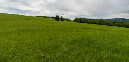 Springtime Bile Karpaty mountains with meadows and forests