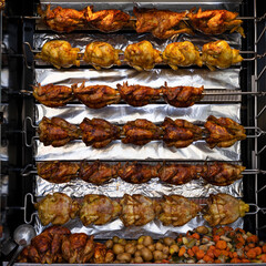 roti chickens in a market