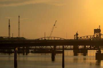 Construction cranes working on the Arkansas River Bridge