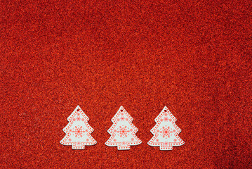 Christmas tree toys made of plywood on a red background
