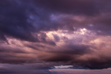Obraz premium Dramatic sunrise, sunset pink violet blue storm sky with clouds background texture 