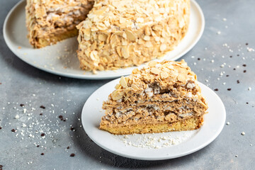 Meringue hazelnut cake with chocolate cream, Food recipe background. Close up. Layered cake