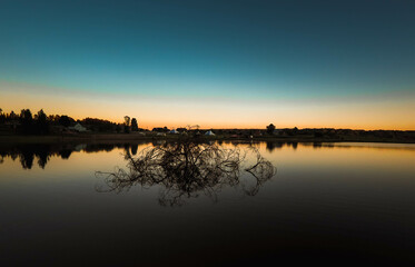 Obraz premium sunset over the river