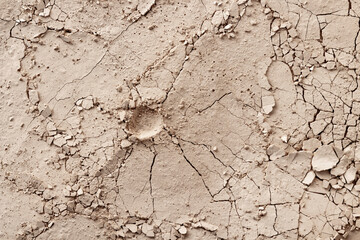 Dry cracked earth and craters during drought and disaster