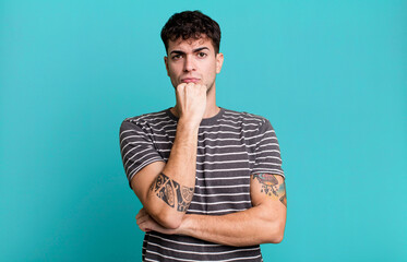 looking serious, confused, uncertain and thoughtful, doubting among options or choices