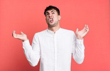 shrugging with a dumb, crazy, confused, puzzled expression, feeling annoyed and clueless