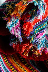 Fototapeta na wymiar Detail of handmade textile by Mayan Indians in Guatemala, colorful cotton, ancestral cosmology.