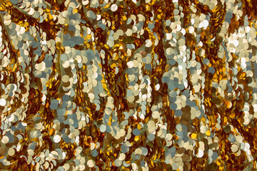Shiny gold background with iridescent sparkles, sequins.