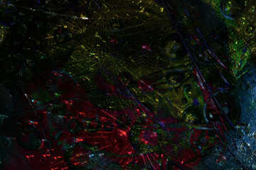 Space abstraction. Dark spheres are illuminated by yellow-red rays of lights and are located against a deep blue background. 3D render.