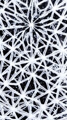The white snowflake rests on the gray background. Its six arms reach out from its center like a...
