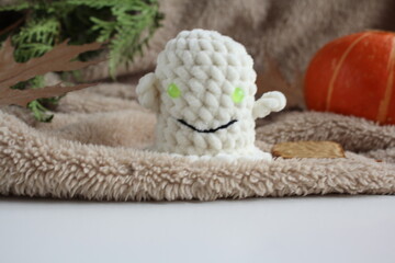 Knitted toys on a table. Natural. Knitted ghosts. Product layout. Knitting. Hobby. flatlay