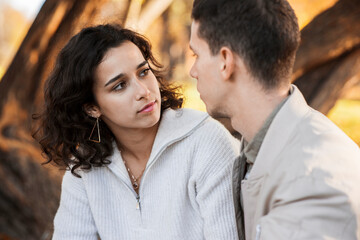 A romantic couple outdoors near a cafe