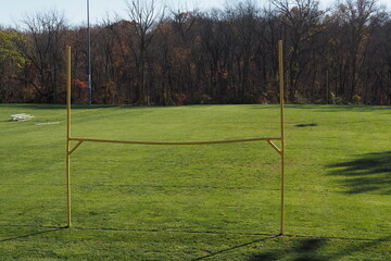 Obraz premium There isn't a game today, however we see the yellow goal post and the field.