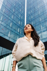 Young asian professional woman wearing elegant blazer looking to the side - Inspired female in...