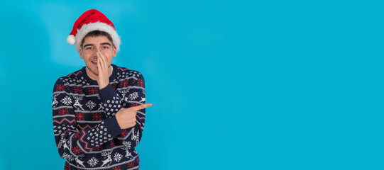 young man in christmas outfit isolated on color background