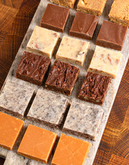 An Assortment of Various Flavors of Fudge on a Wood Butcher Block