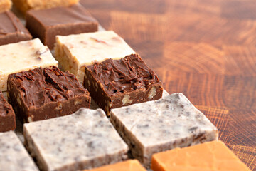 An Assortment of Various Flavors of Fudge on a Wood Butcher Block