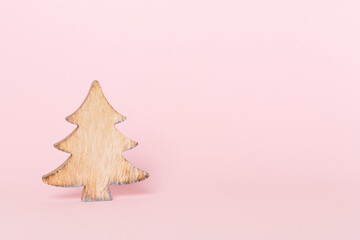 Wooden Christmas tree on color backgrond