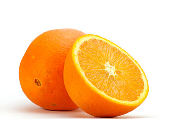 Fresch orange and an orange cut through the middle photographed with a white background

