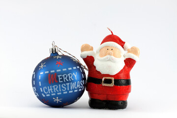 Blue Christmas ball with the text Merry Christmas and a red and white Santa Claus isolated on white background 