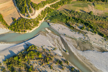 Aerial view of river Osumi by village Mbrakull near Polican in Albania in Summer sunrise
