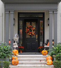 Halloween decorations on front porch and steps of house