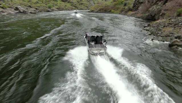 Aerial above jet boats in Snake River in Hells Canyon, Idaho