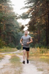 Man having run at forest