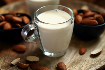 Almonds and almond milk in a glass.